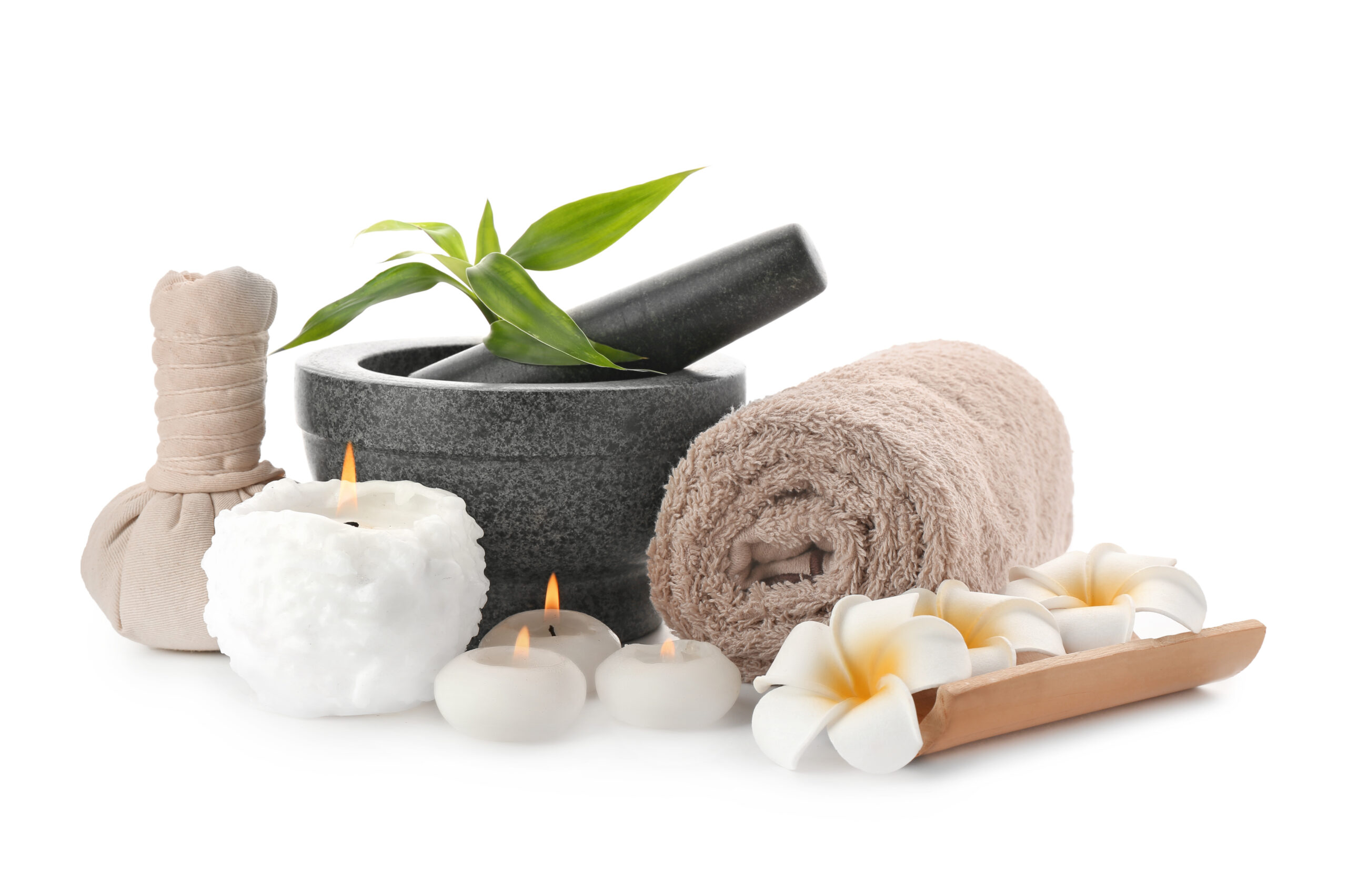 Spa composition with mortar, candles and clean towel on white background